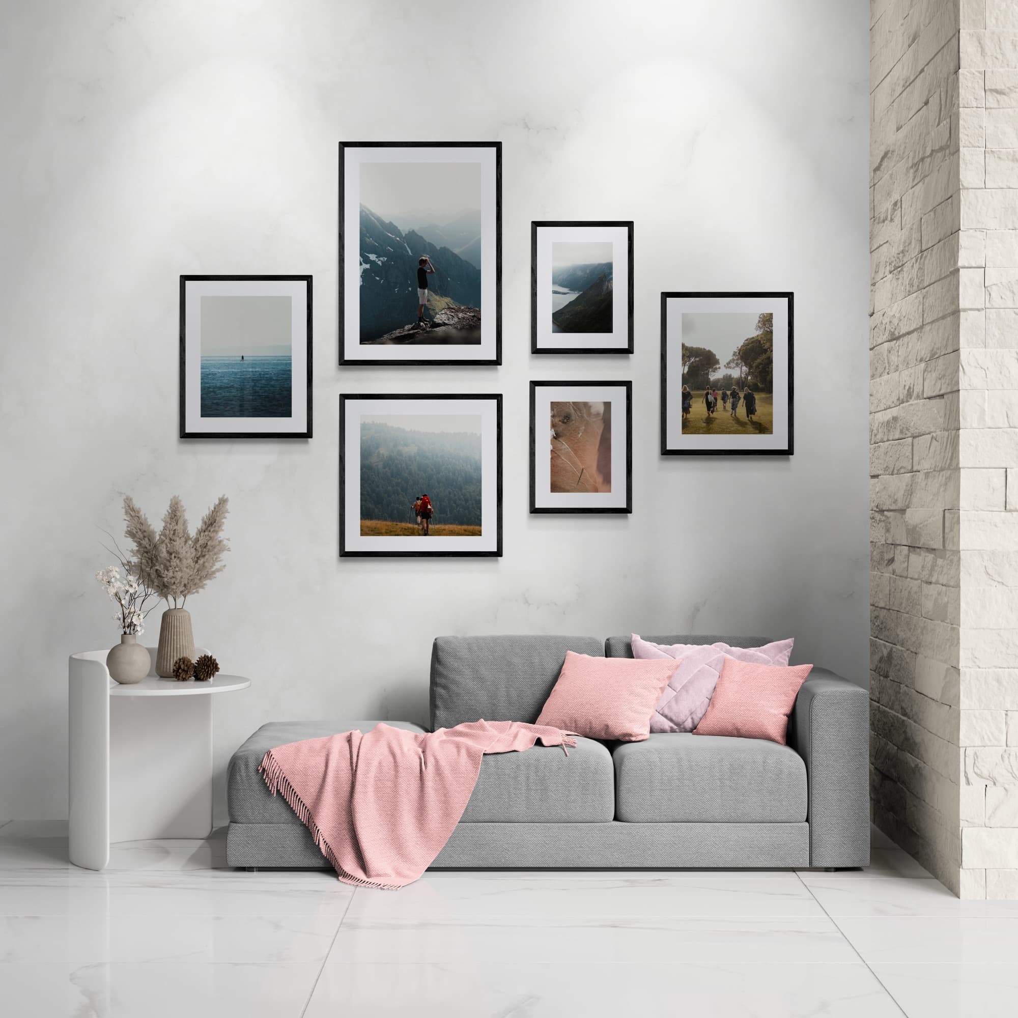 The Oak gallery wall, with six black framed prints above a grey sofa